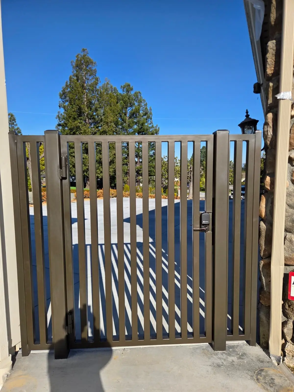 Bronze aluminum walk gate with a keypad lock